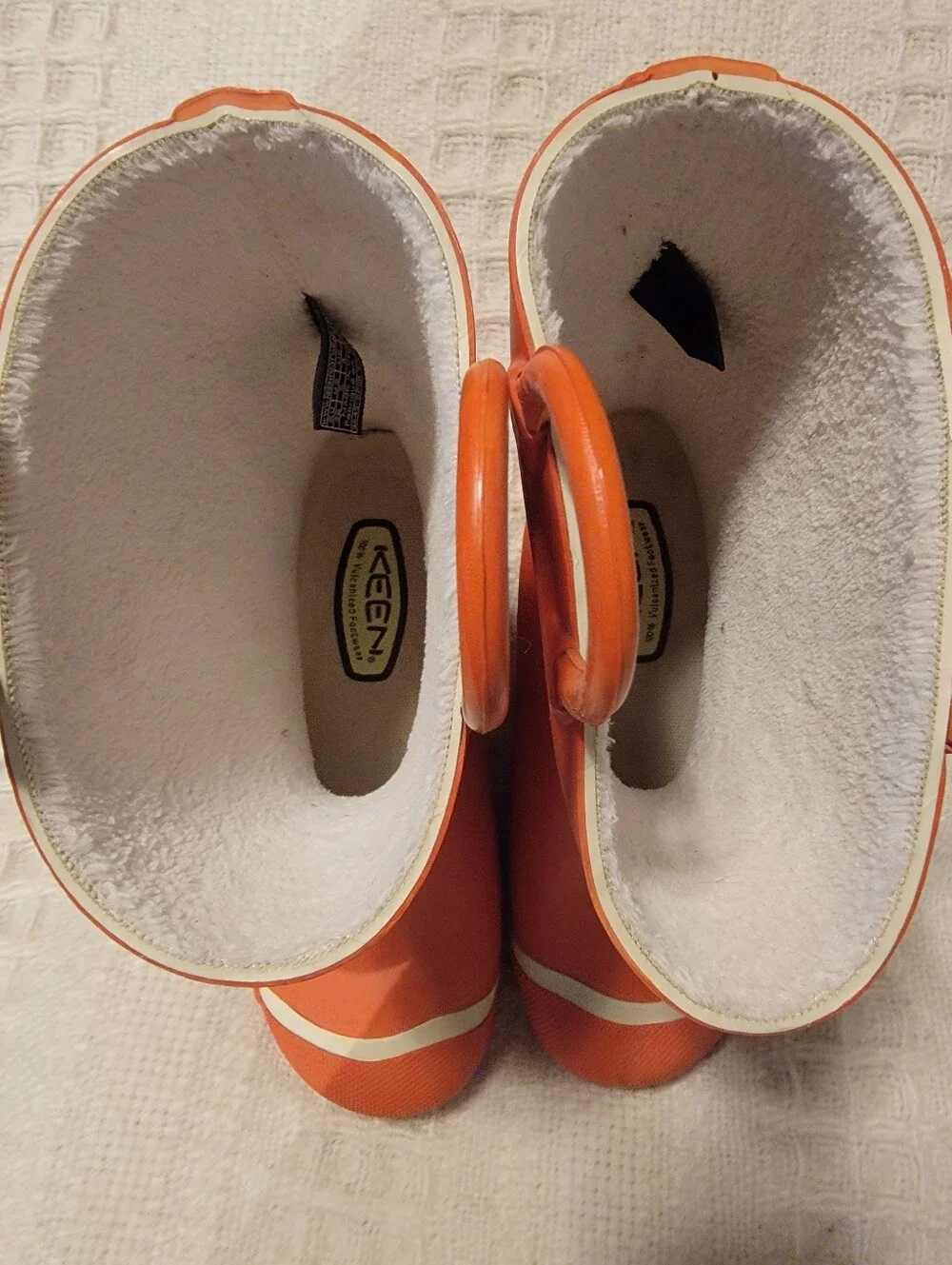 Keen orange and floral-patterned Coronado kids' waterproof rain boots